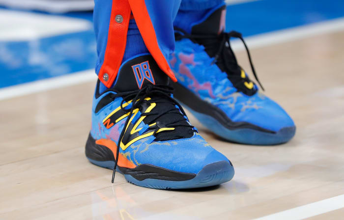 View of blue and black New Balance shoes.